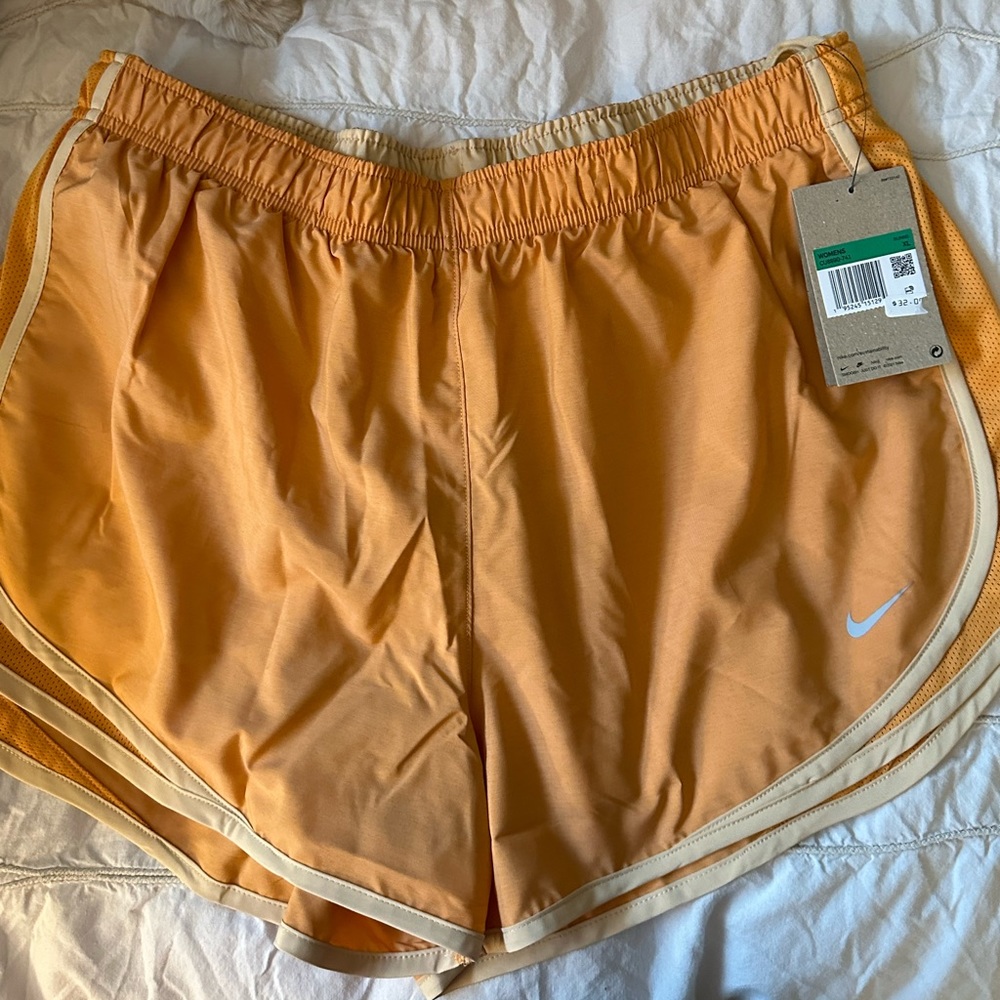 Women’s Nike Tempo Shorts in orange. Size XL, NWT.